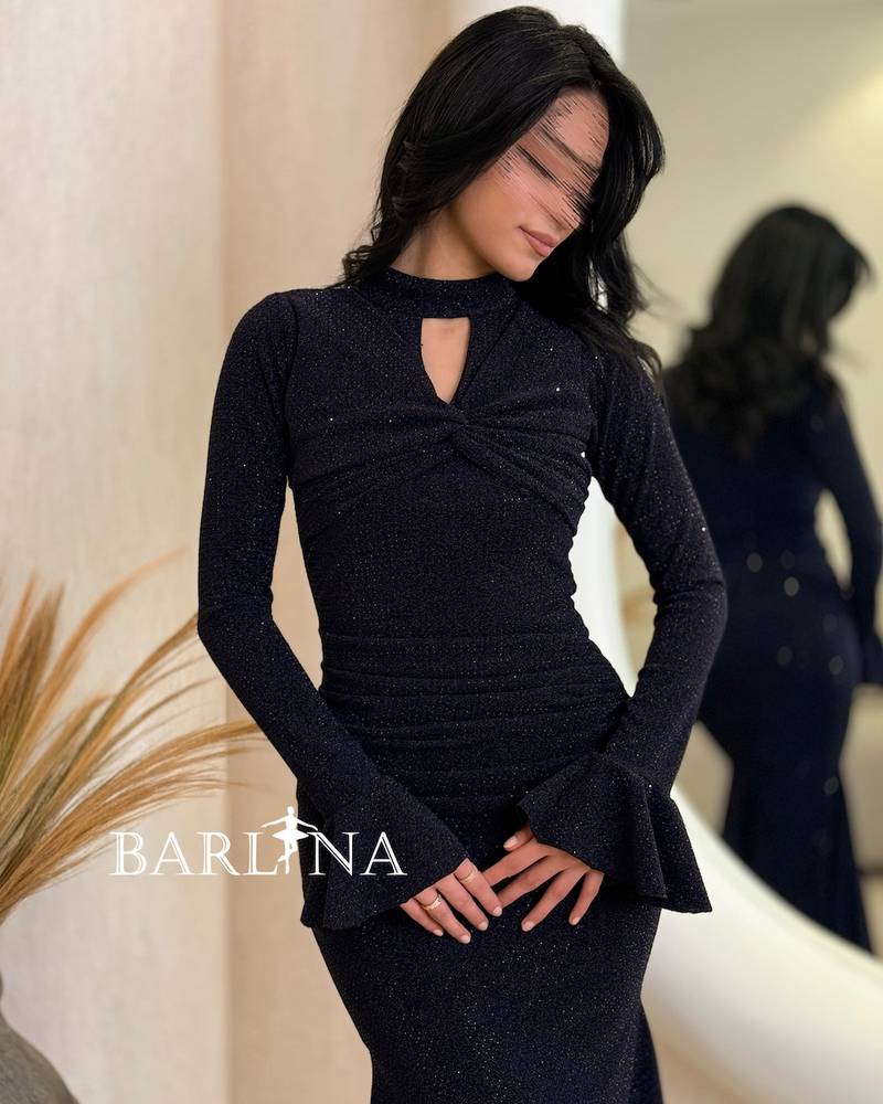 A shiny navy blue dress with wide sleeves at the cuffs