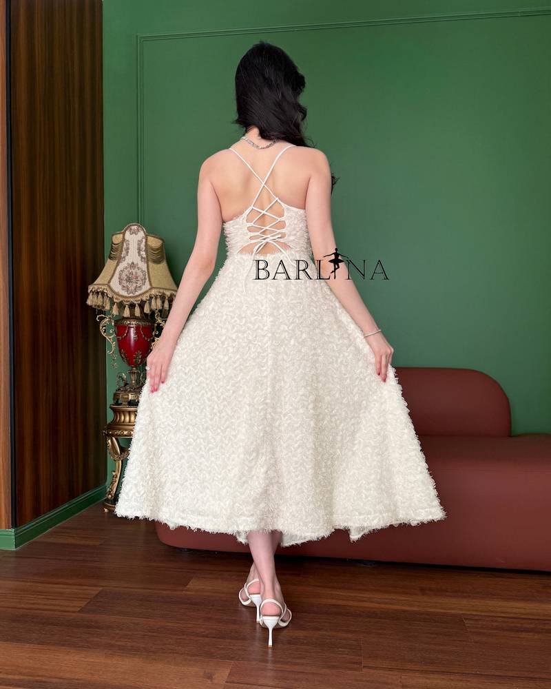 Soft off-white dress with a midi length and elegant details