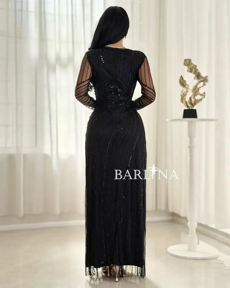 Elegant evening dress adorned with shimmering embroidery lines