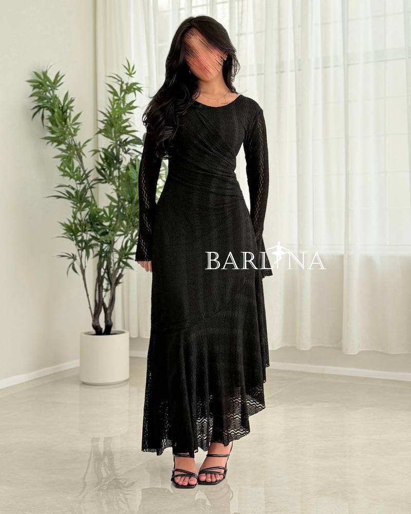 Black asymmetrical dress with a soft ruffled touch