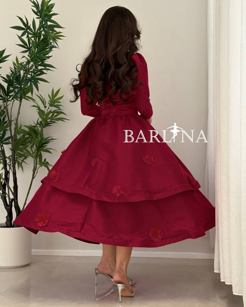 A burgundy mid-length dress with a sweetheart neckline