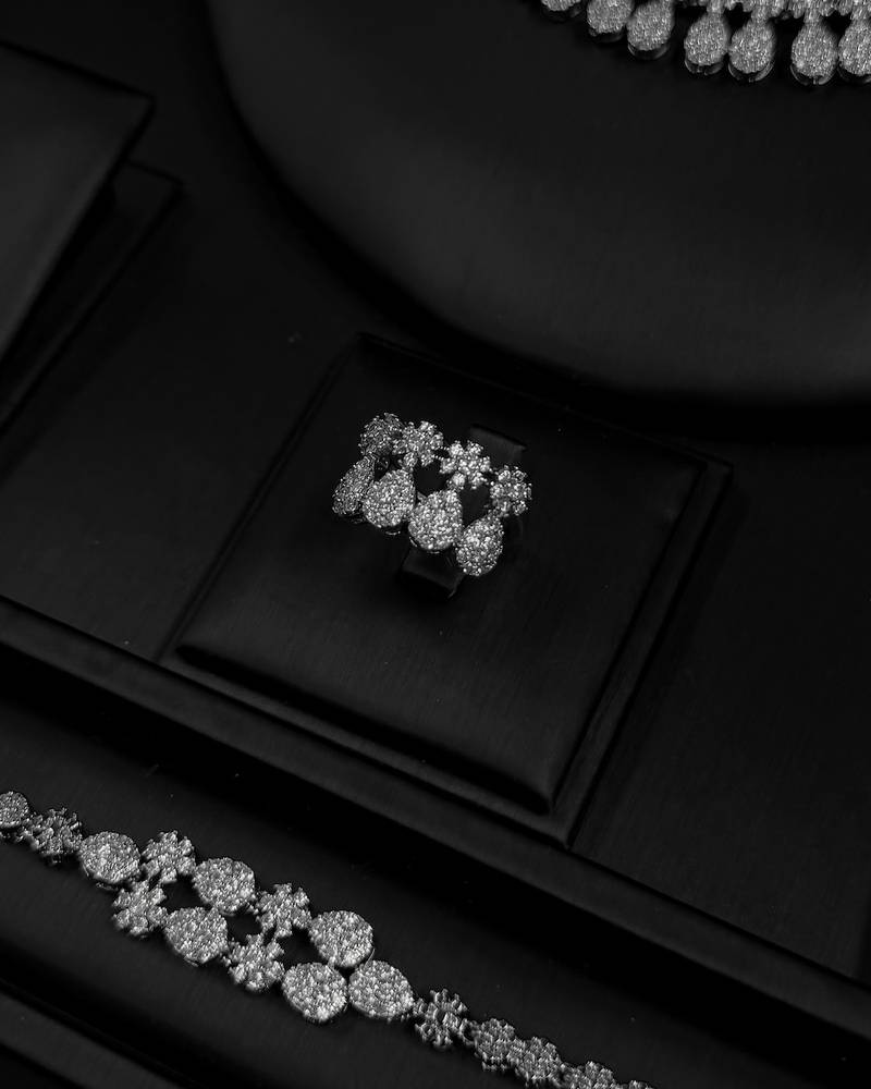 Elegant accessory set with a repeating, draped design