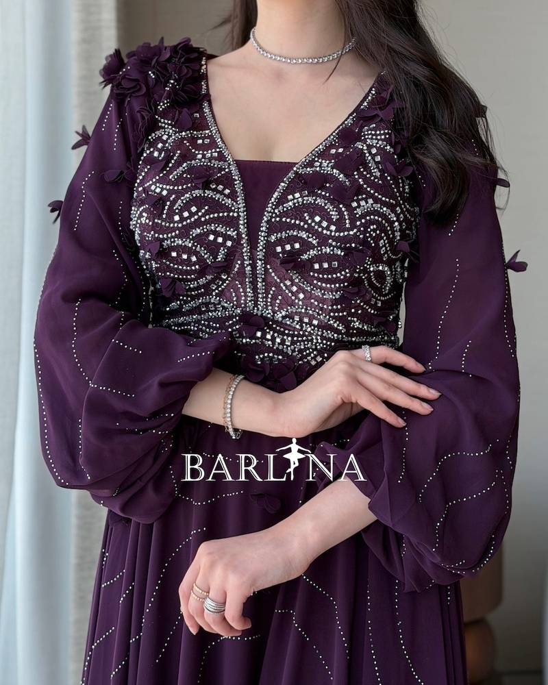 A purple flared dress embroidered with silver beads