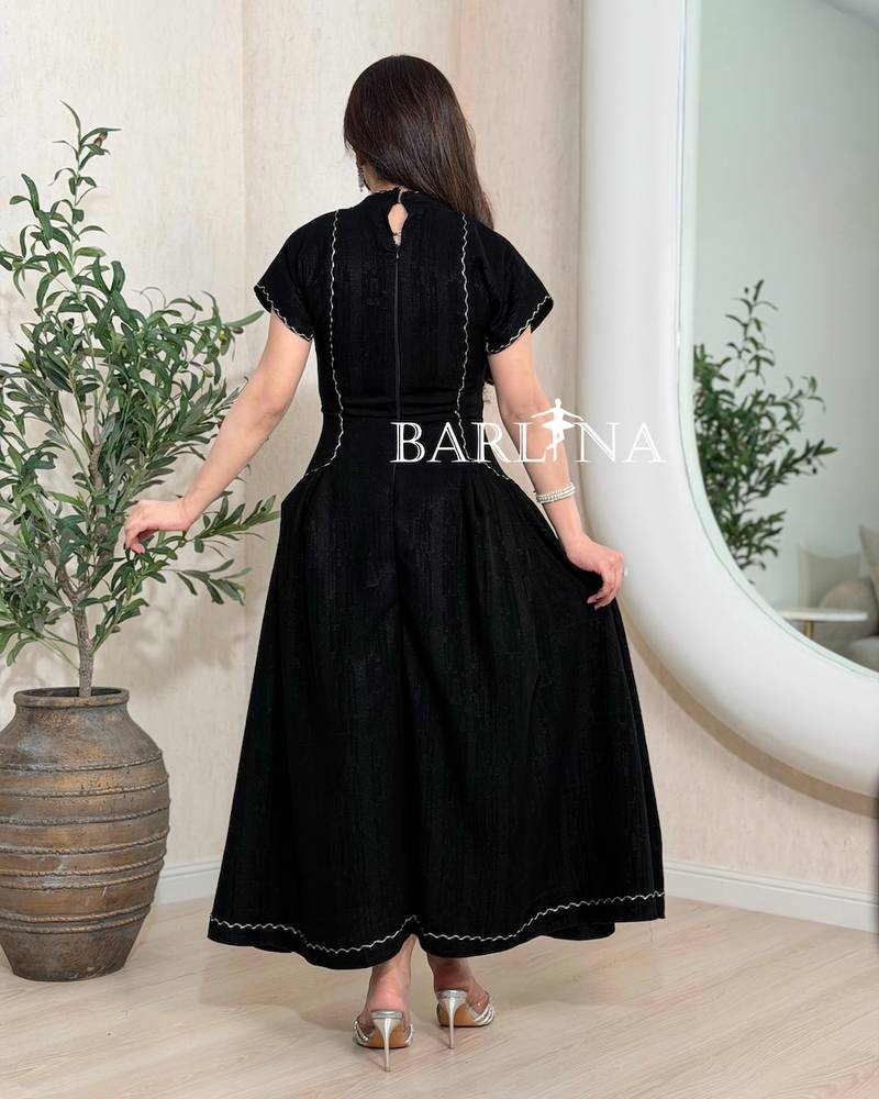 Black dress with front buttons and zigzag embroidery