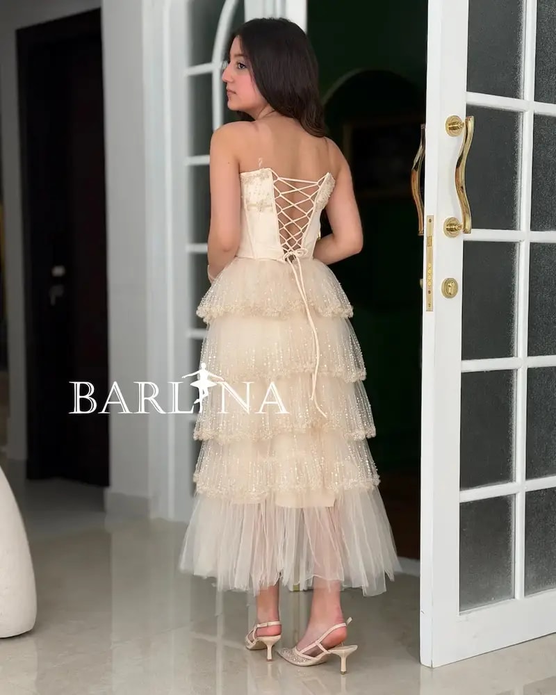 Creamy dress with layers of shimmering tulle