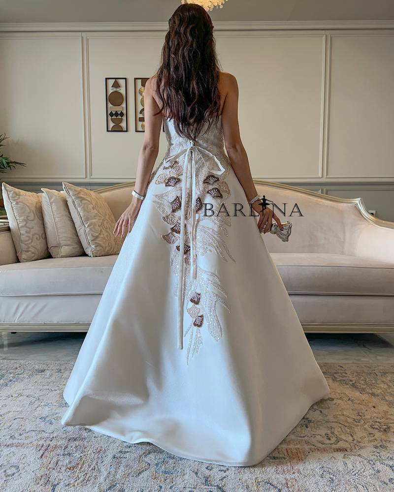 Off white evening dress with brown embellishments