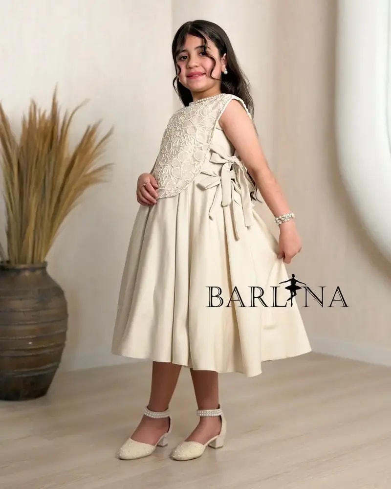 Elegant beige girls' dress with side tie