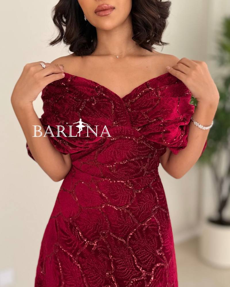 A red dress with an elegant design and luxurious embroidery.