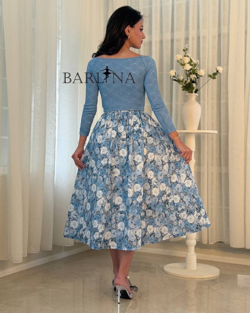 A feminine sky-blue outfit with a floral skirt
