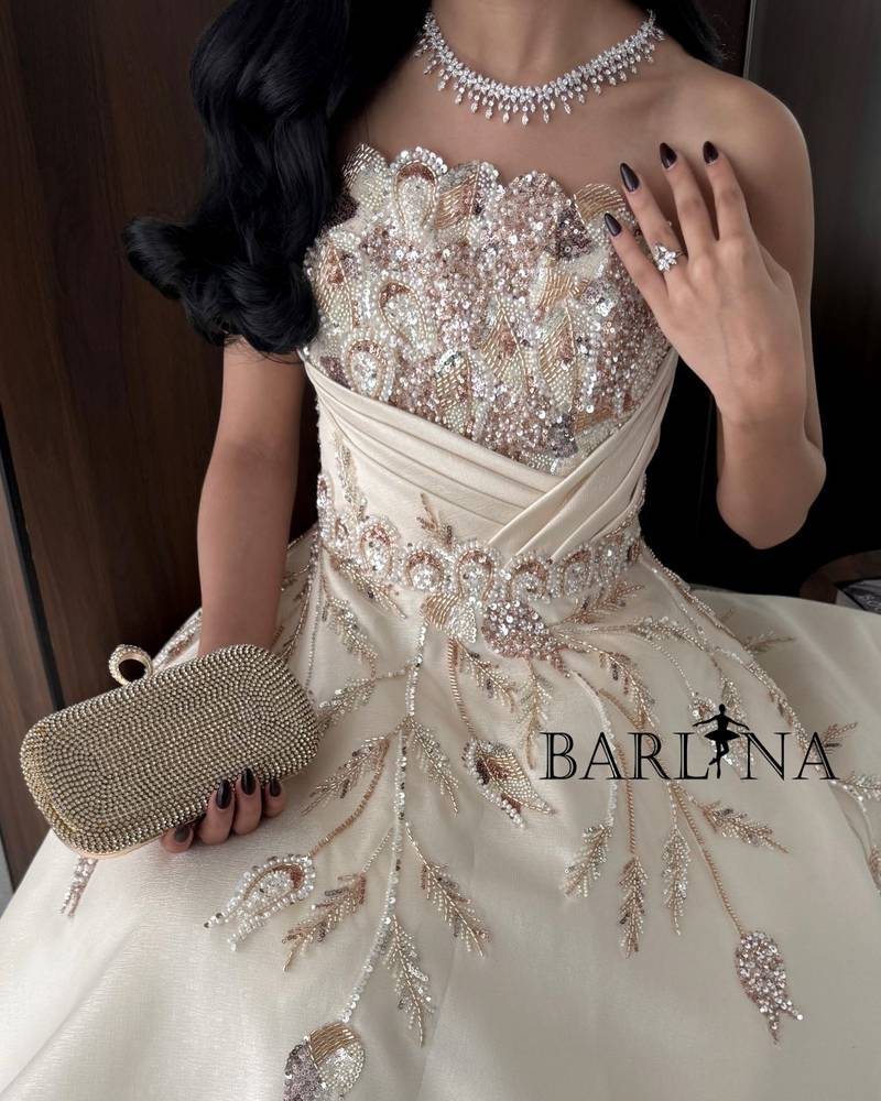 Beige evening dress with gold embroidery
