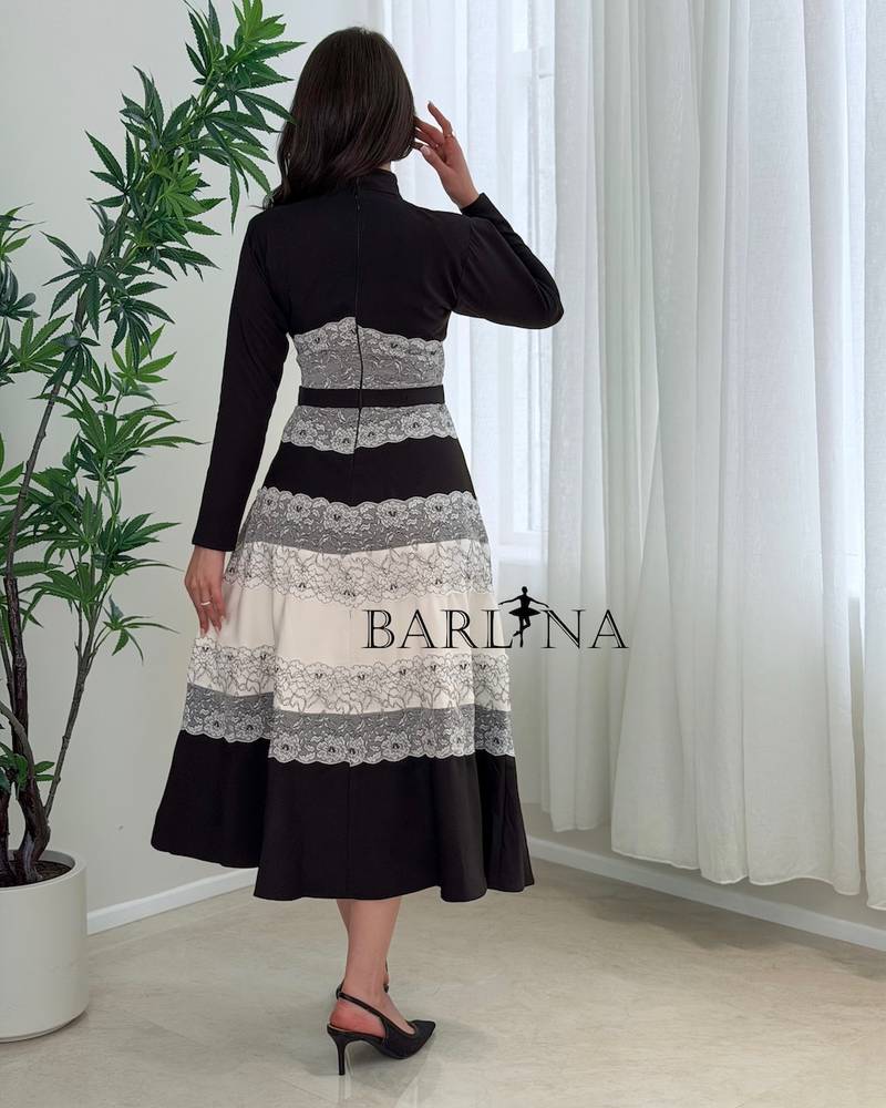 Elegant dress with black and white lace layers 