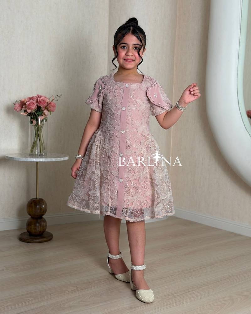 Pink girls' dress with a sheer overlay decorated with roses