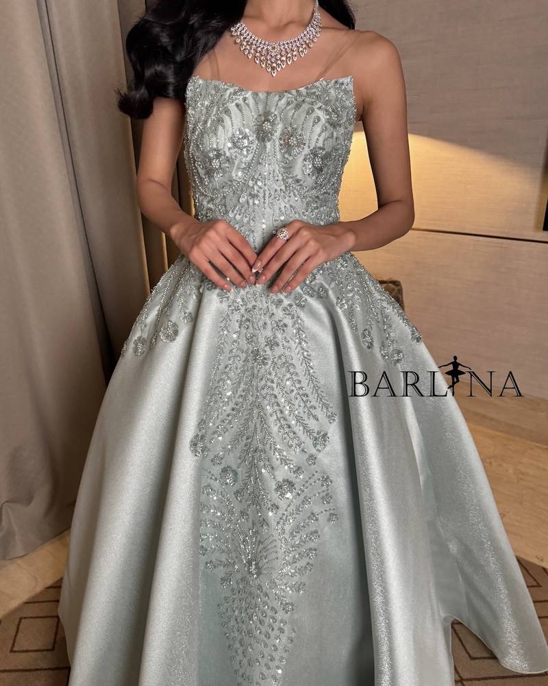 Light green dress with elaborate floral motifs