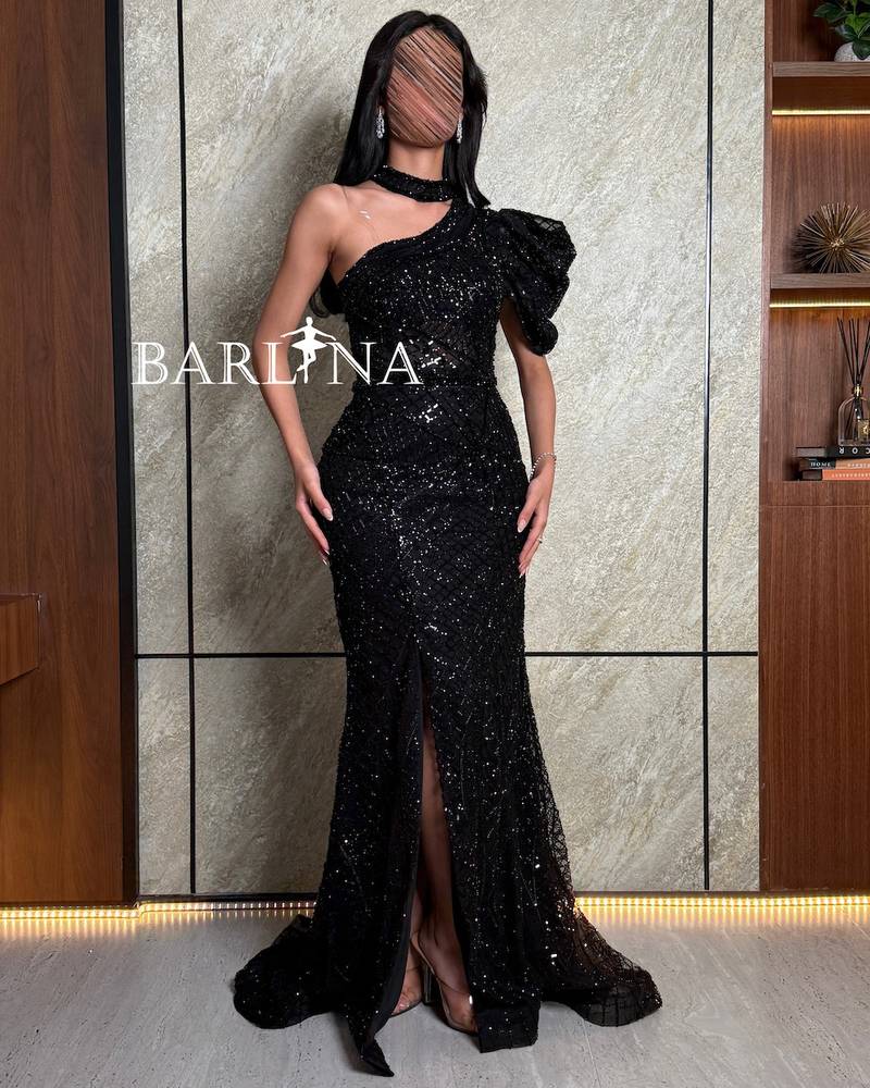 Black one-shoulder shiny dress with front slit
