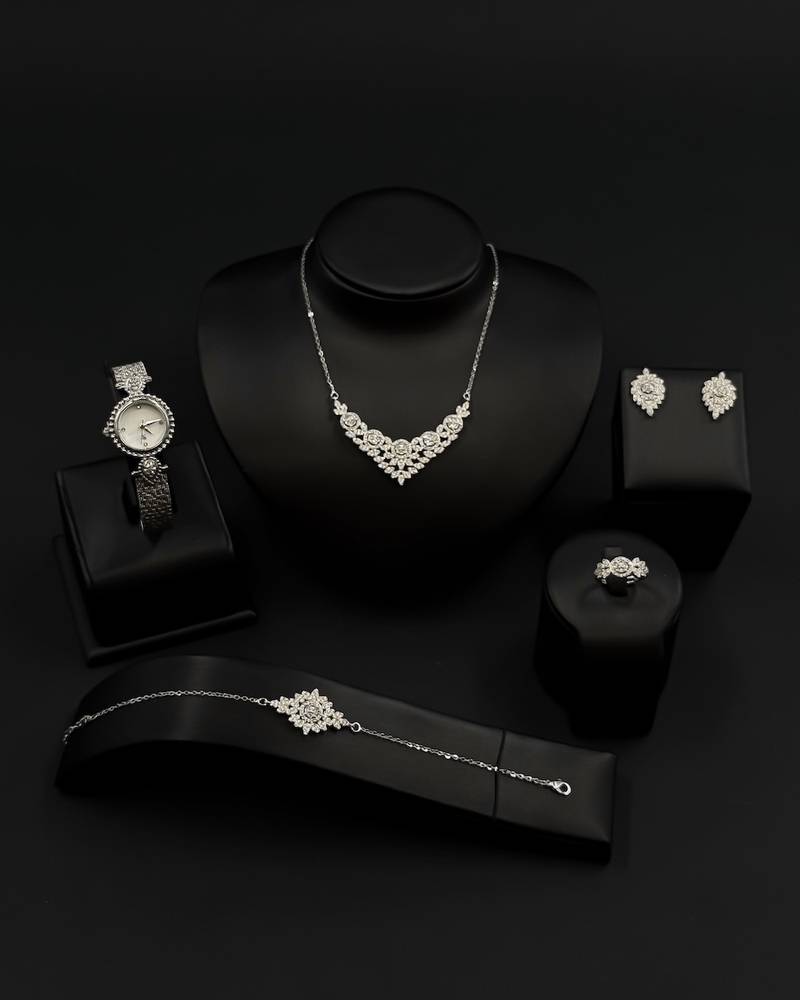 A delicately designed accessory set with a jeweled watch.