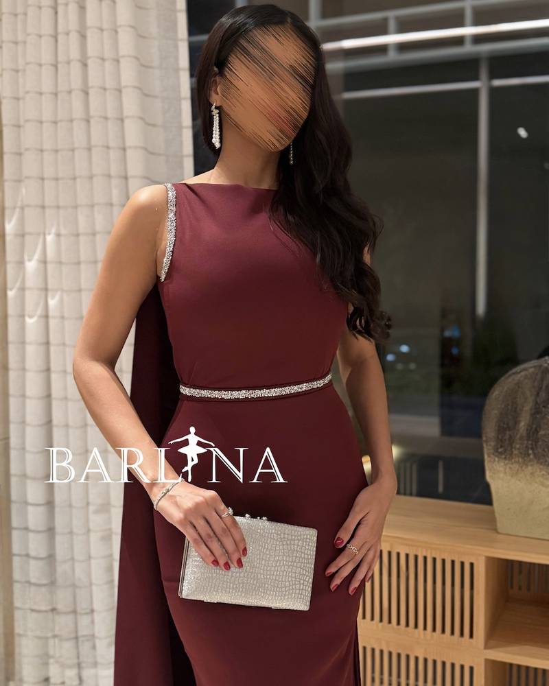 A luxurious burgundy dress with shimmering details