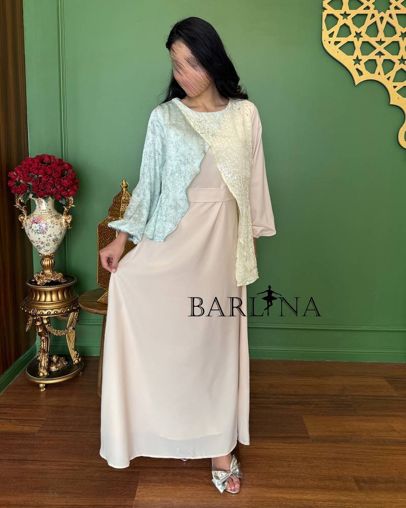 A soft beige jalabiya with overlapping layers