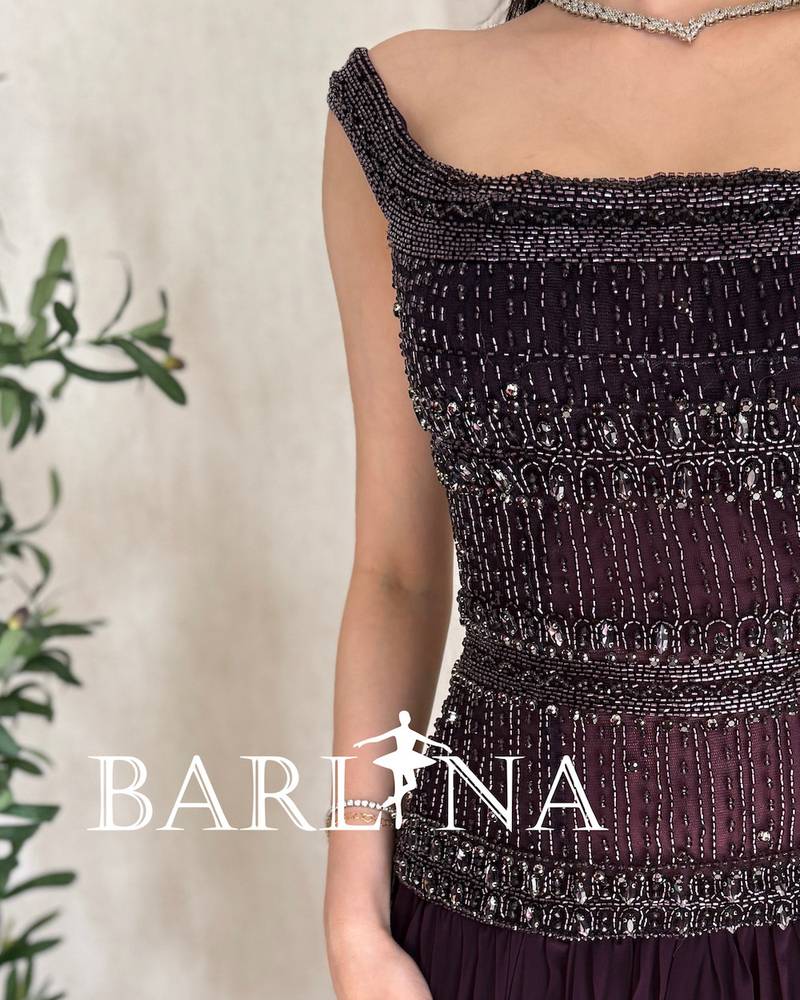 Elegant purple dress with heavy embroidery on the top