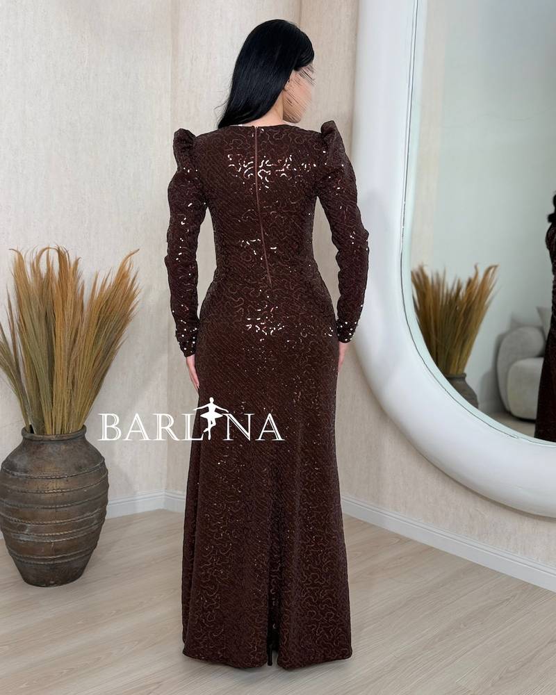 Brown dress with light embroidery and a side slit