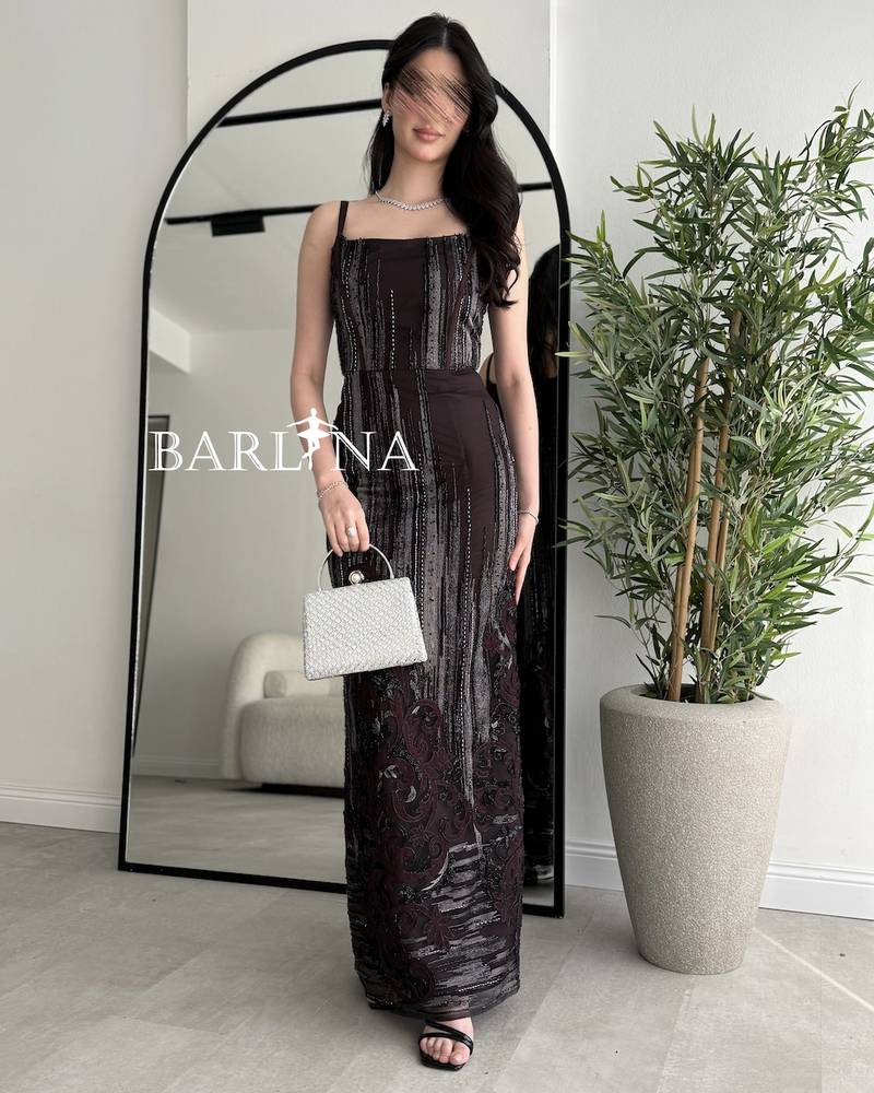 Dark brown dress adorned with artistic embroidery