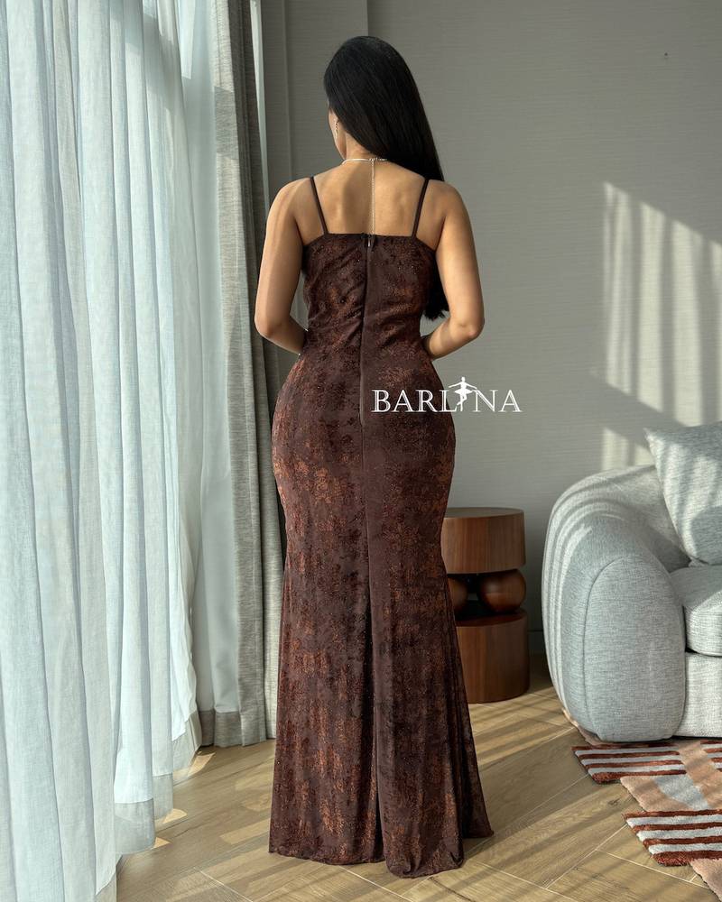 Long brown dress with shiny fabric and a fitted silhouette