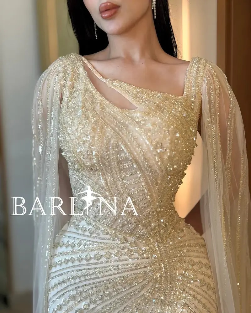 Luxurious off-white evening dress with shimmering embroidery