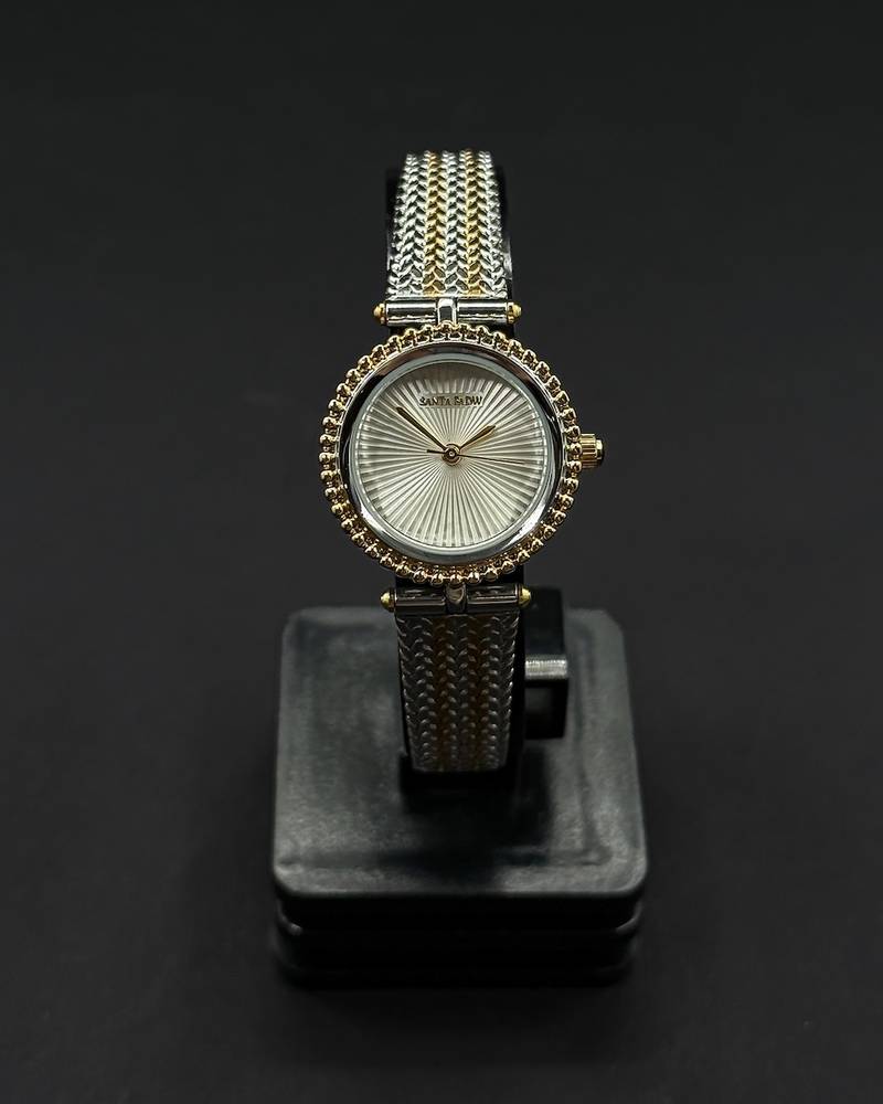 A classic round watch with a woven strap
