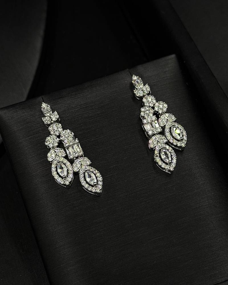 An evening accessory set intricately adorned with diamonds