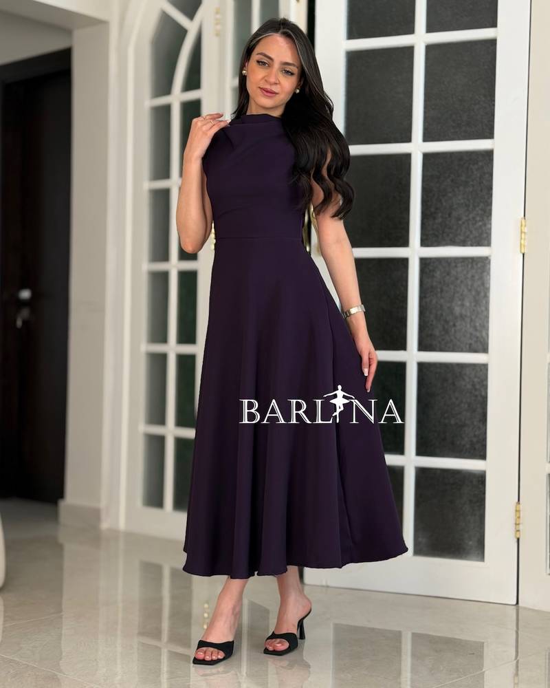 Dark purple midi dress with a flowing neckline