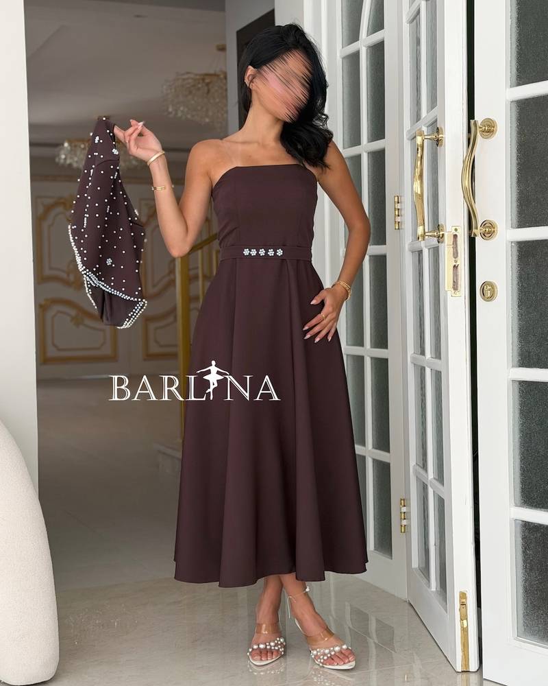 Brown dress with a crystal-embellished off-the-shoulder piece