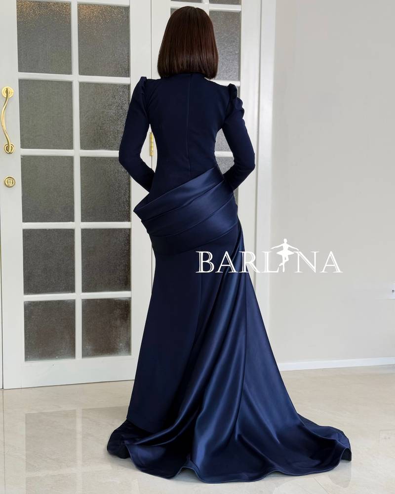 Navy blue dress with a royal cut and a side train