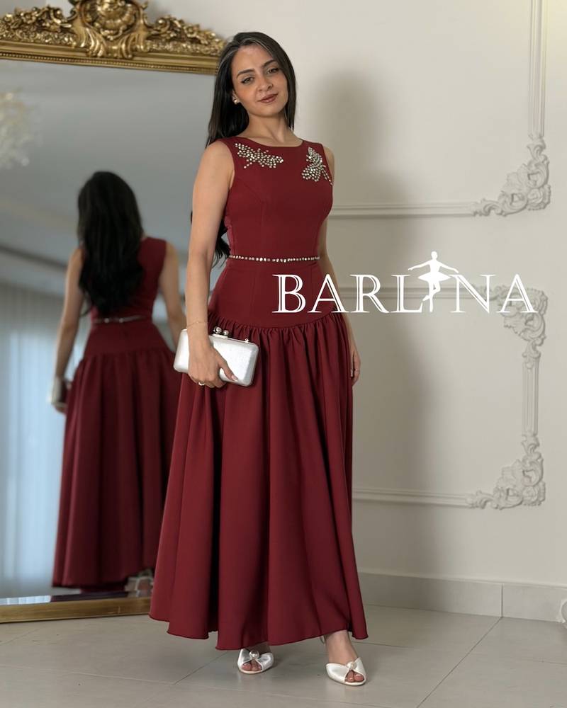 Long burgundy flared dress with a low waist