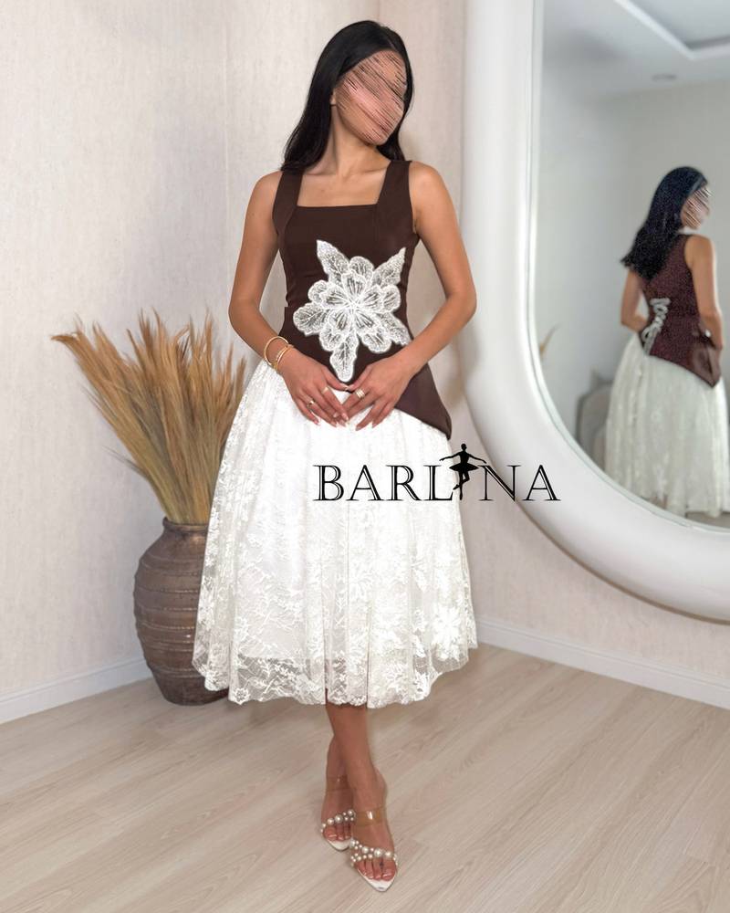Soft brown and white embellished dress