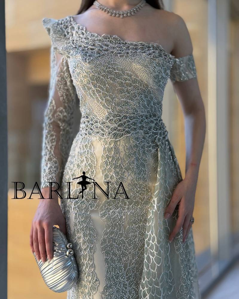 Elegant beige dress with asymmetrical sleeves