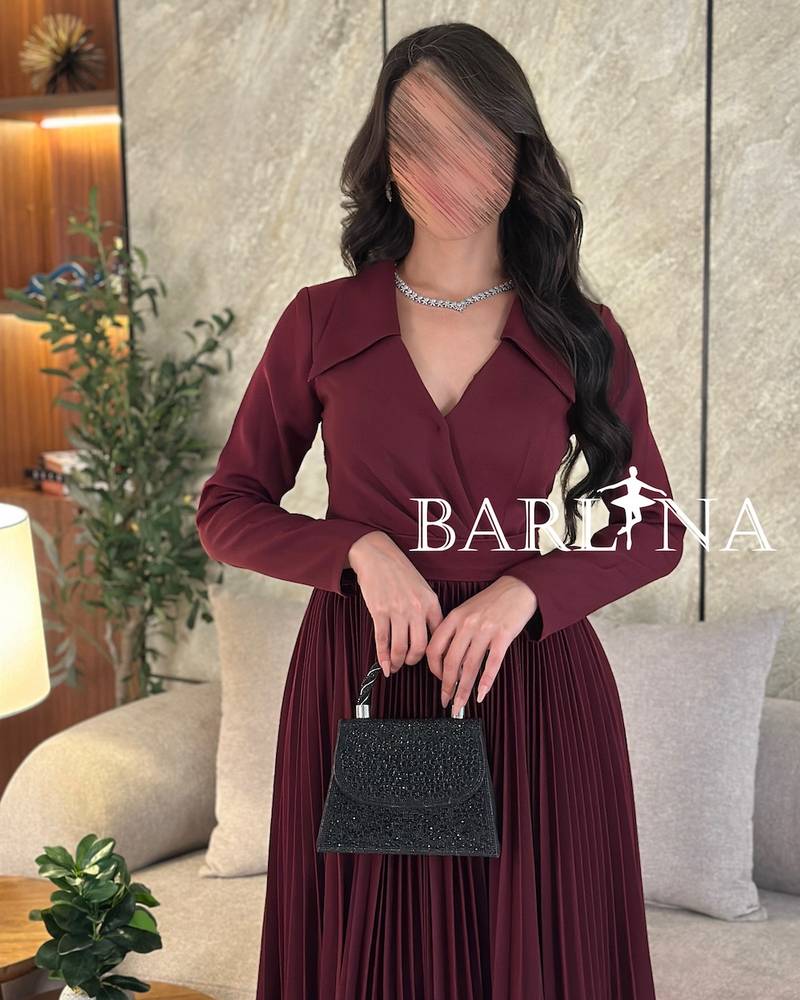 maroon dress with pleated folds