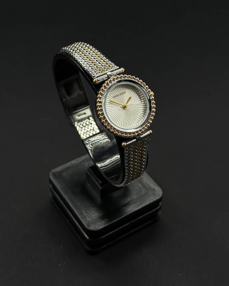 A classic round watch with a woven strap