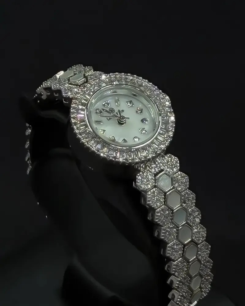 A luxurious women's watch adorned with sparkling stones