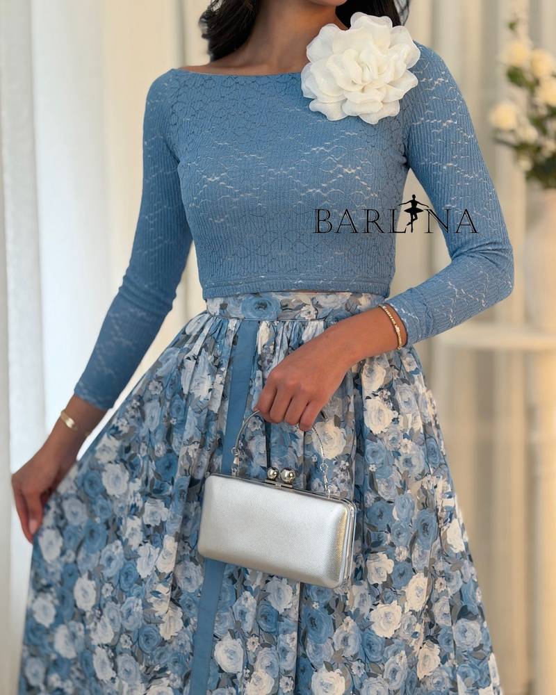 A feminine sky-blue outfit with a floral skirt