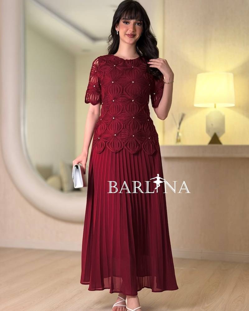Soft pleated dress with embroidered bodice
