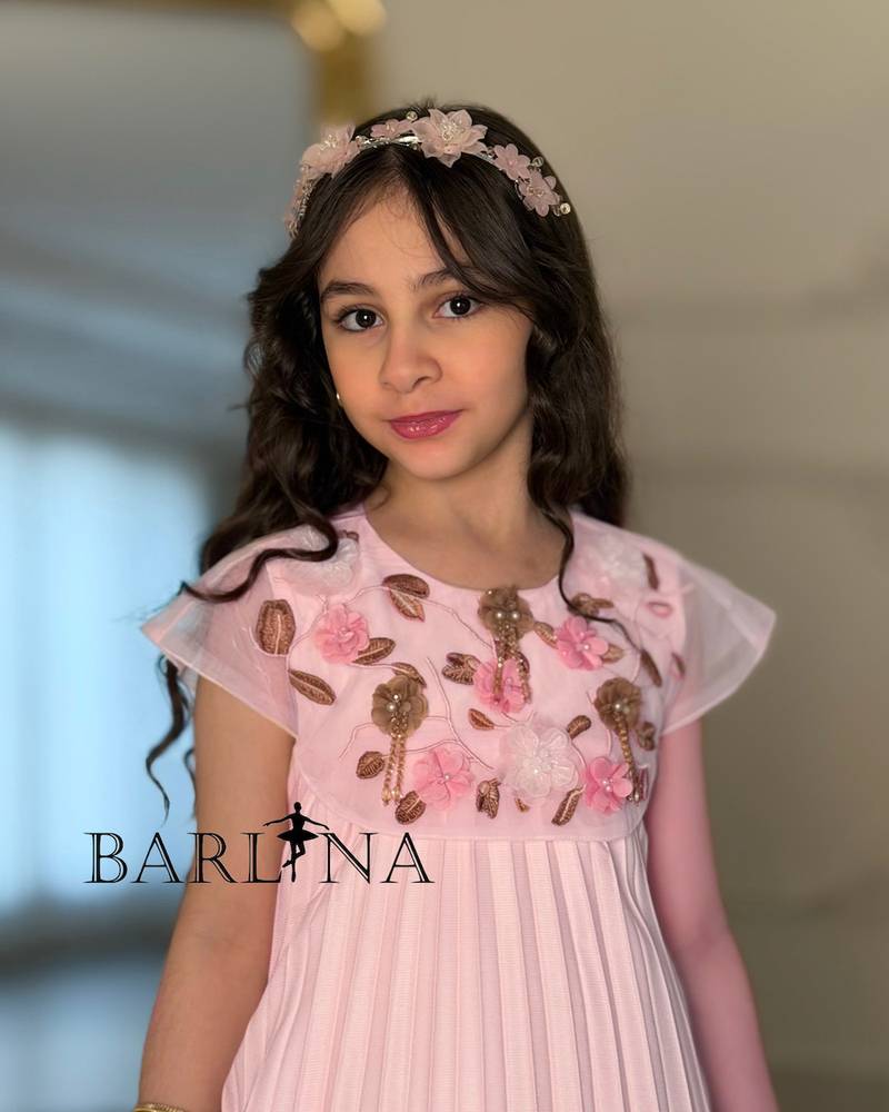 A soft girl's dress with floral embroidery