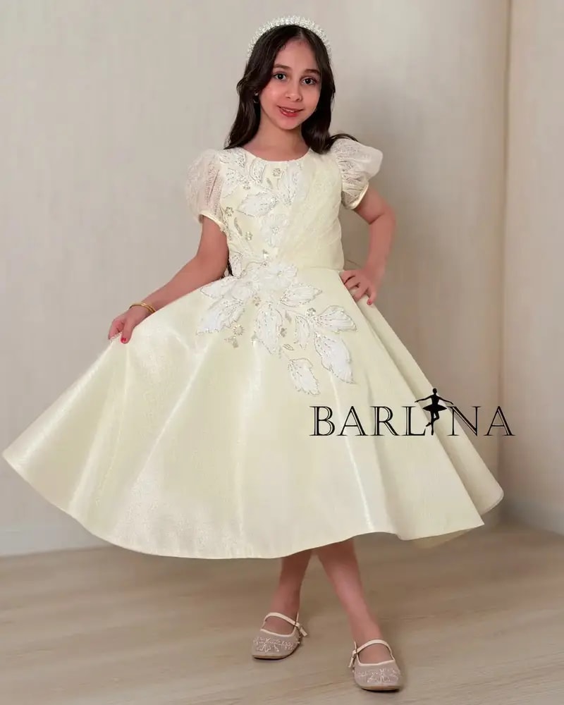 Lemon-colored girls' dress with elegant embroidery details