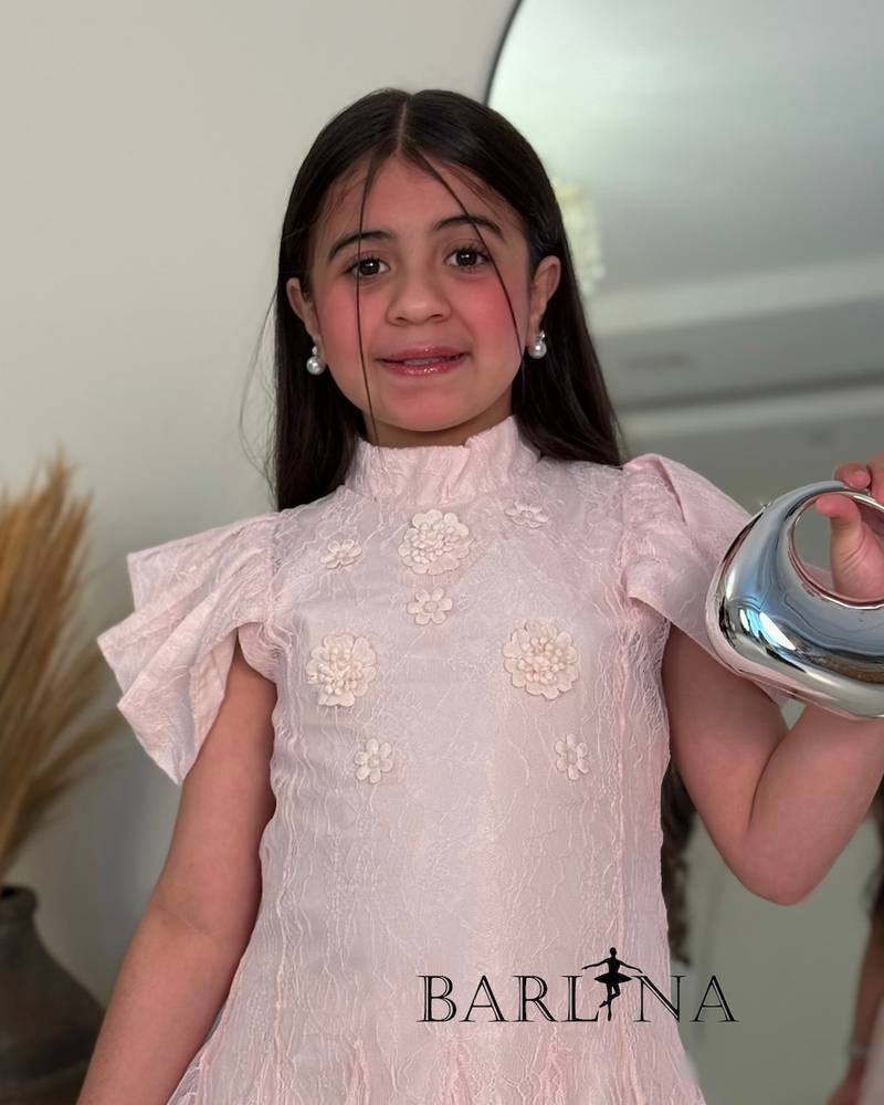A soft girls’ lace dress with a feminine design