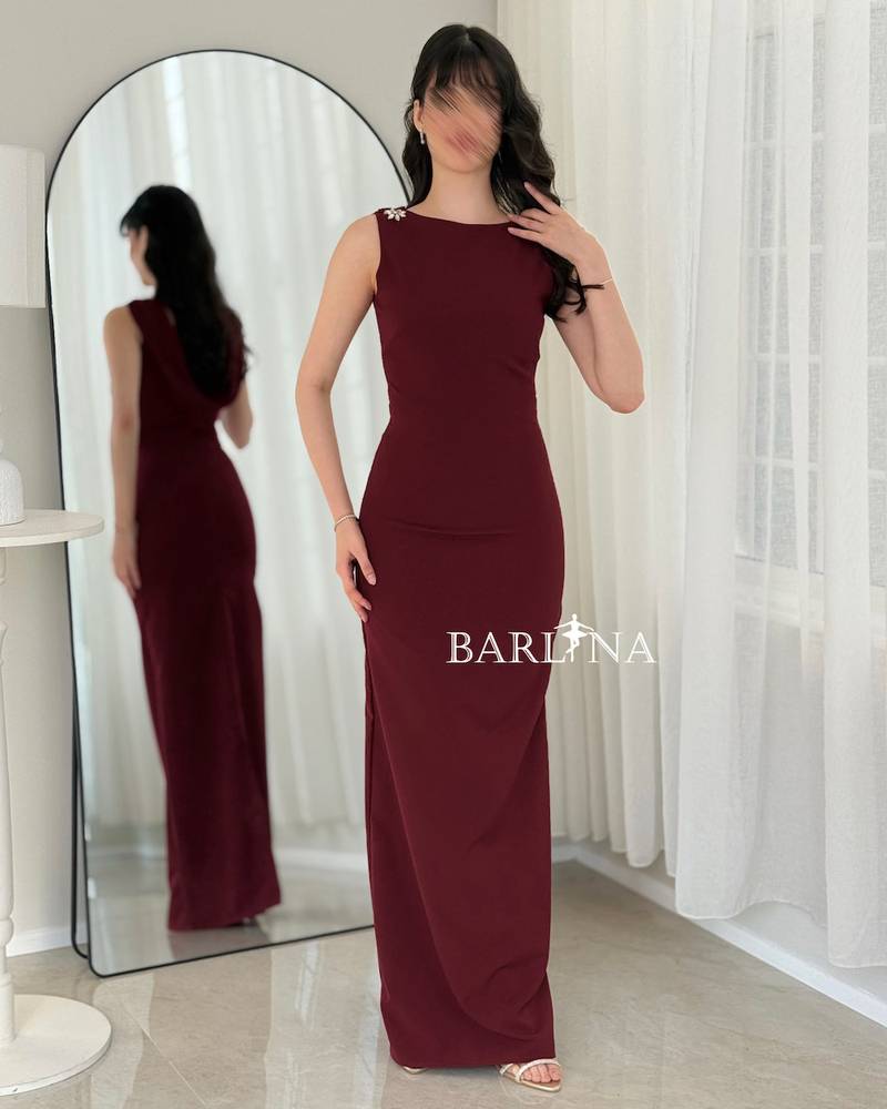 A soft burgundy dress adorned with crystal details