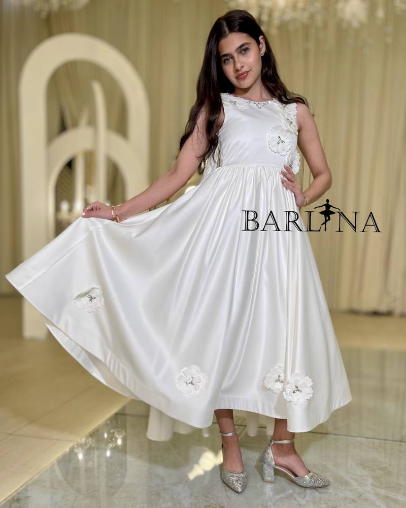 White dress with open back decorated with flowers