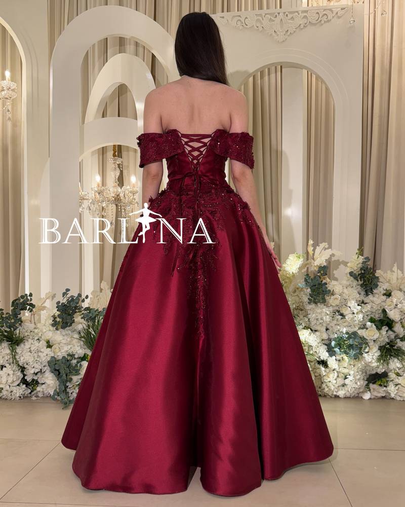 Off-shoulder burgundy dress with prominent embroidery