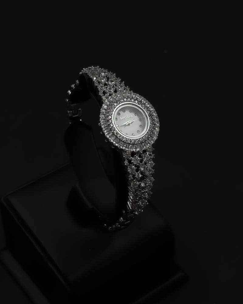 Women's watch with a round design and crystal embellishments