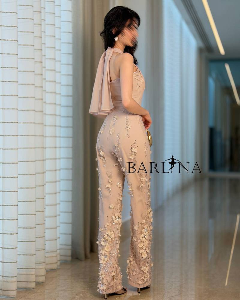 Luxurious beige jumpsuit embroidered with roses and sequins