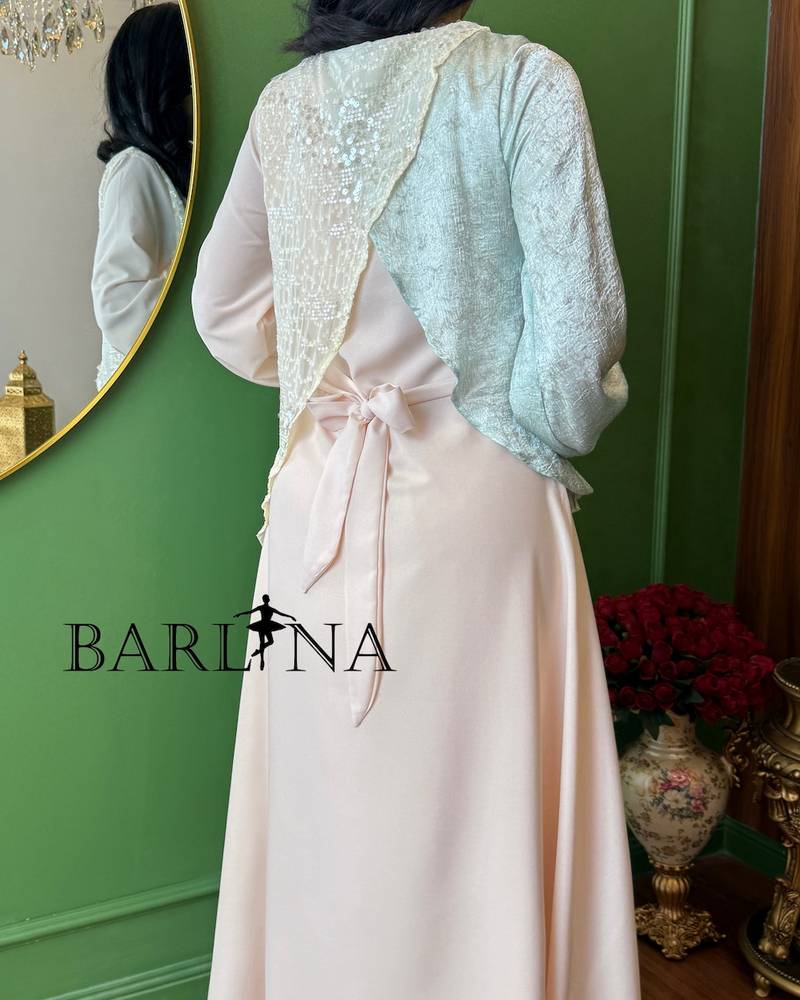 A soft beige jalabiya with overlapping layers