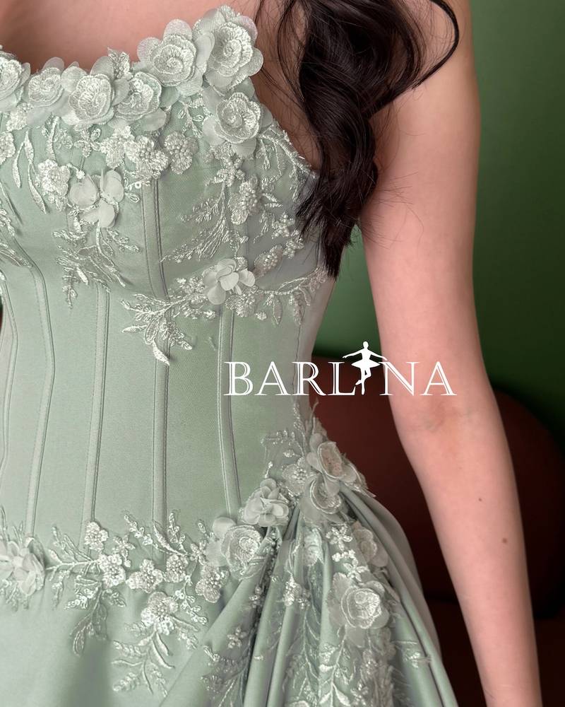 Pistachio green dress with a gathered waist design