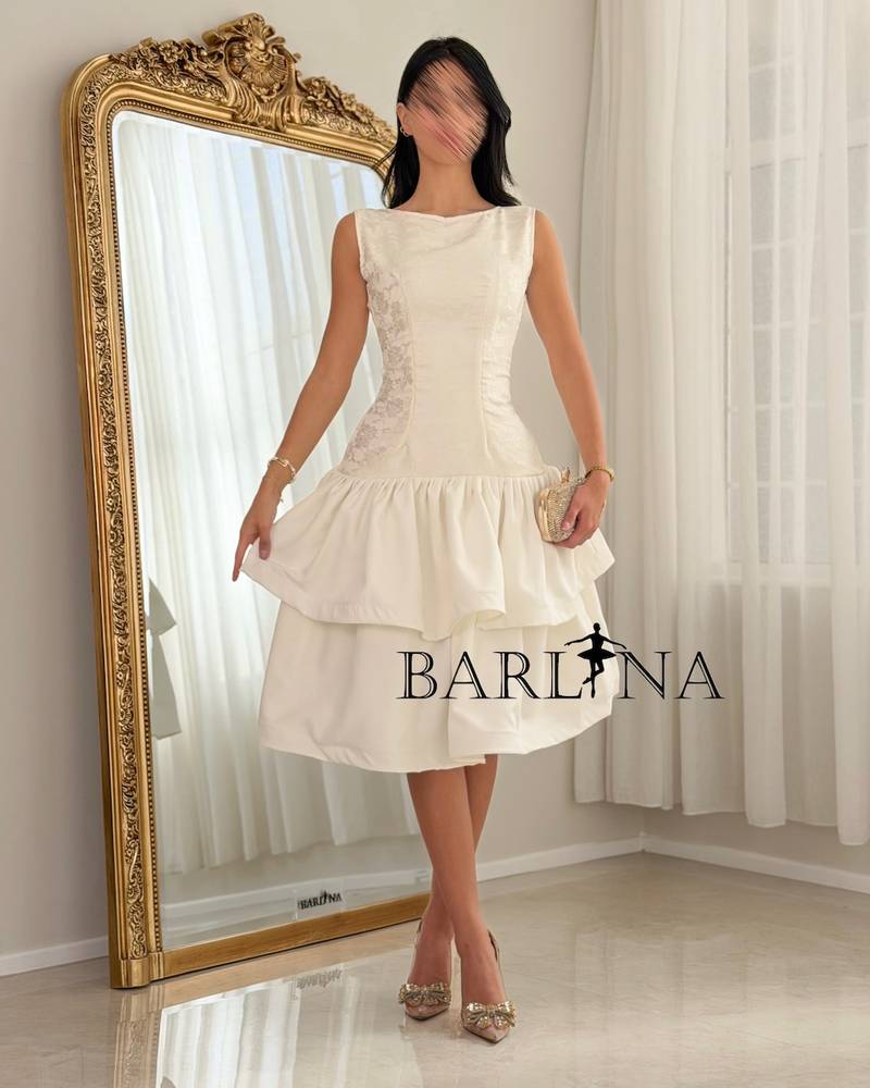 A soft dress with a low waist and layers of ruffles